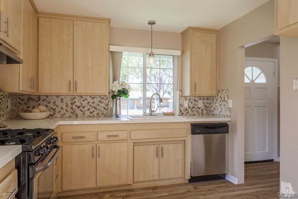 864 Appleton Road Simi Valley, CA 93065 - Photo 12 of 32 a kitchen with white cabinets and sink