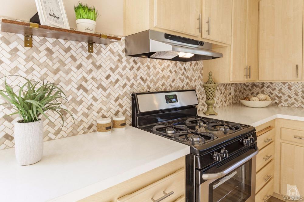 864 Appleton Road Simi Valley, CA 93065 - Photo 13 of 32 a kitchen with a stove and a white cabinet