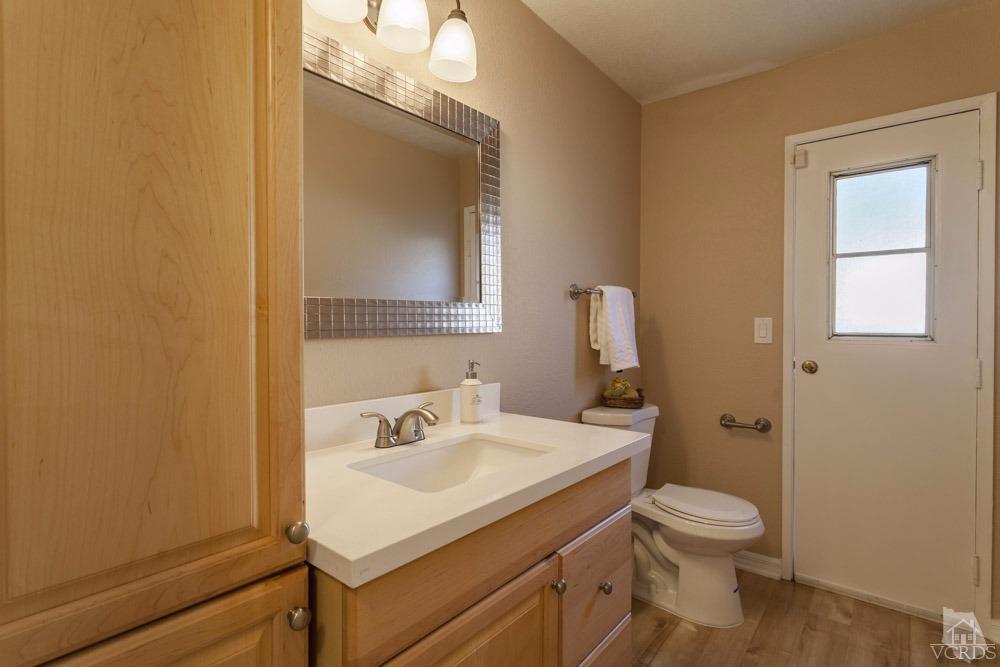864 Appleton Road Simi Valley, CA 93065 - Photo 15 of 32 a bathroom with a sink mirror and toilet