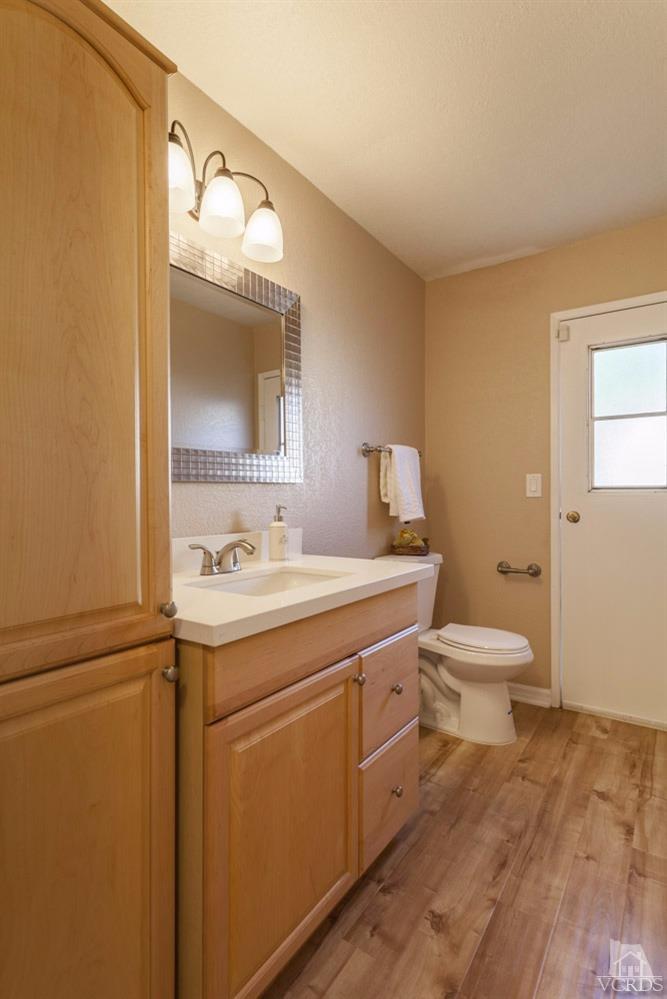 864 Appleton Road Simi Valley, CA 93065 - Photo 16 of 32 a bathroom with a toilet sink and mirror