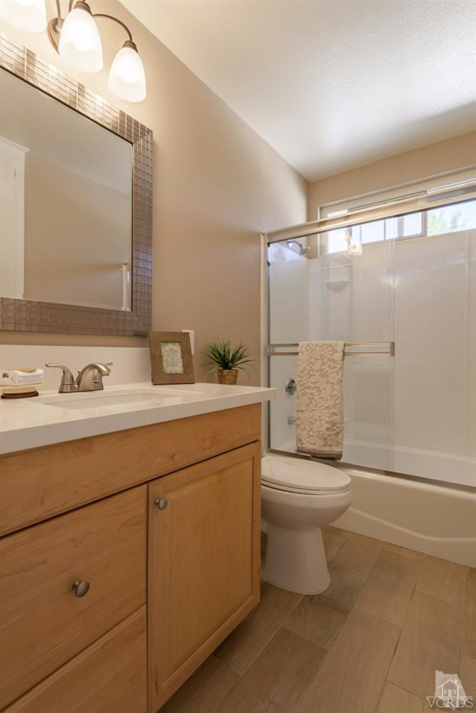 864 Appleton Road Simi Valley, CA 93065 - Photo 22 of 32 a bathroom with a toilet sink and mirror
