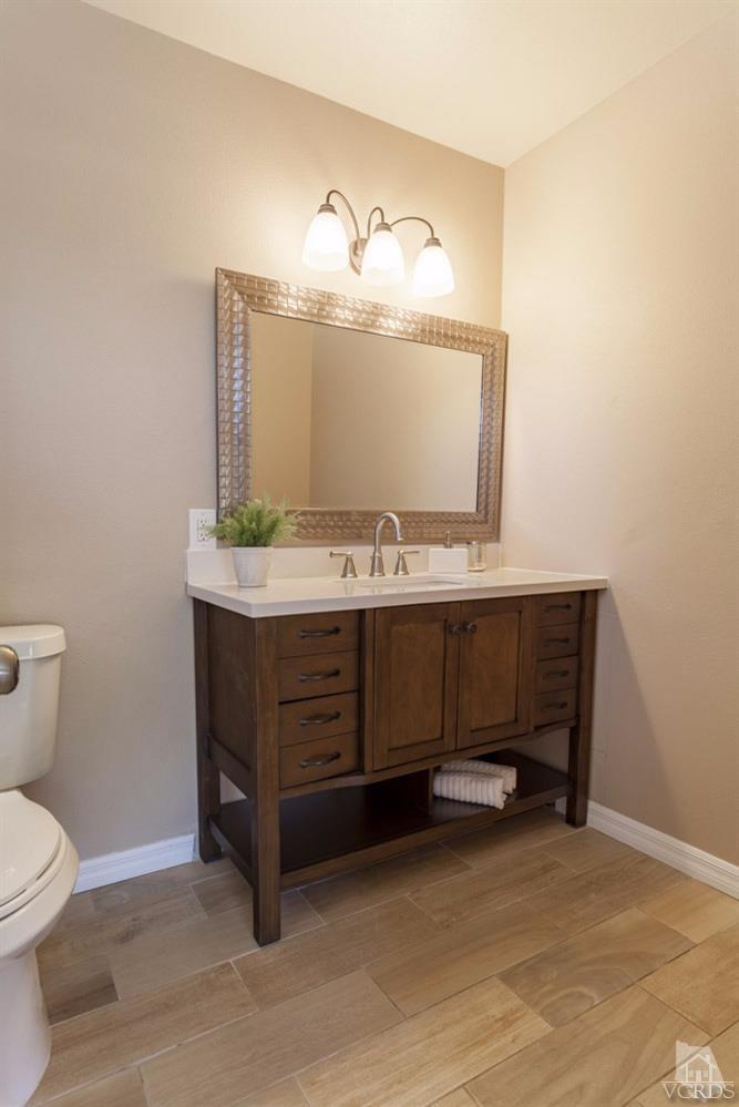 864 Appleton Road Simi Valley, CA 93065 - Photo 27 of 32 a bathroom with a sink and a toilet