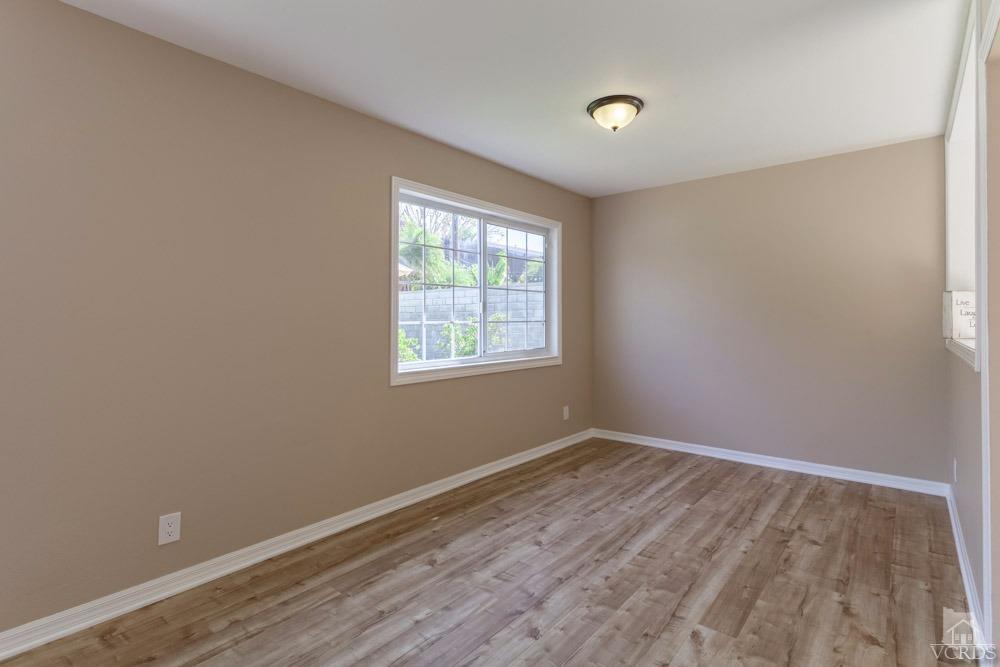 864 Appleton Road Simi Valley, CA 93065 - Photo 6 of 32 wooden floor in an empty room with a window