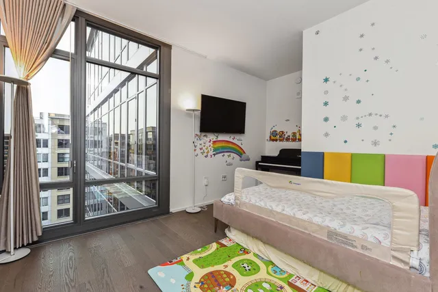 a bedroom with a bed and a view of bathroom