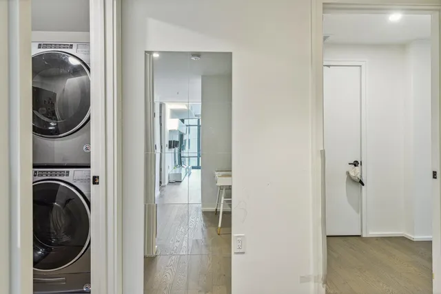 a view of a balcony with two chairs and a flat screen tv