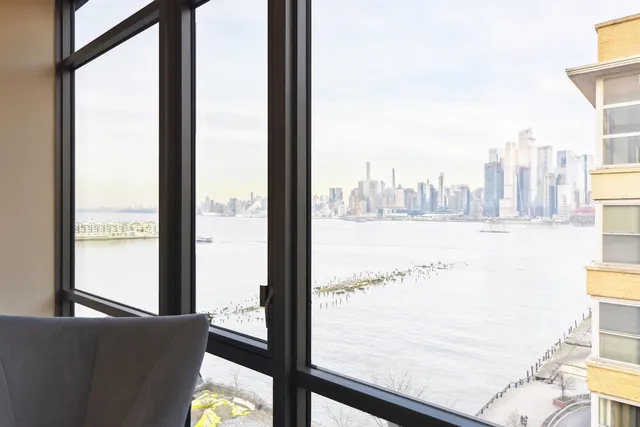 a bathroom with a shower sink vanity mirror and toilet