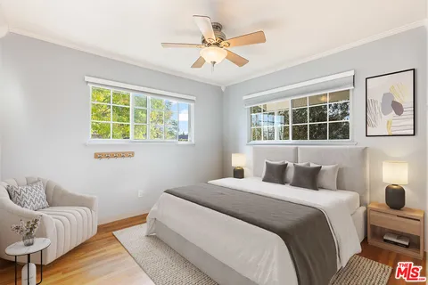 a bedroom with a bed and a couch