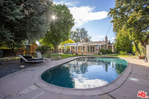 a view of a house with swimming pool