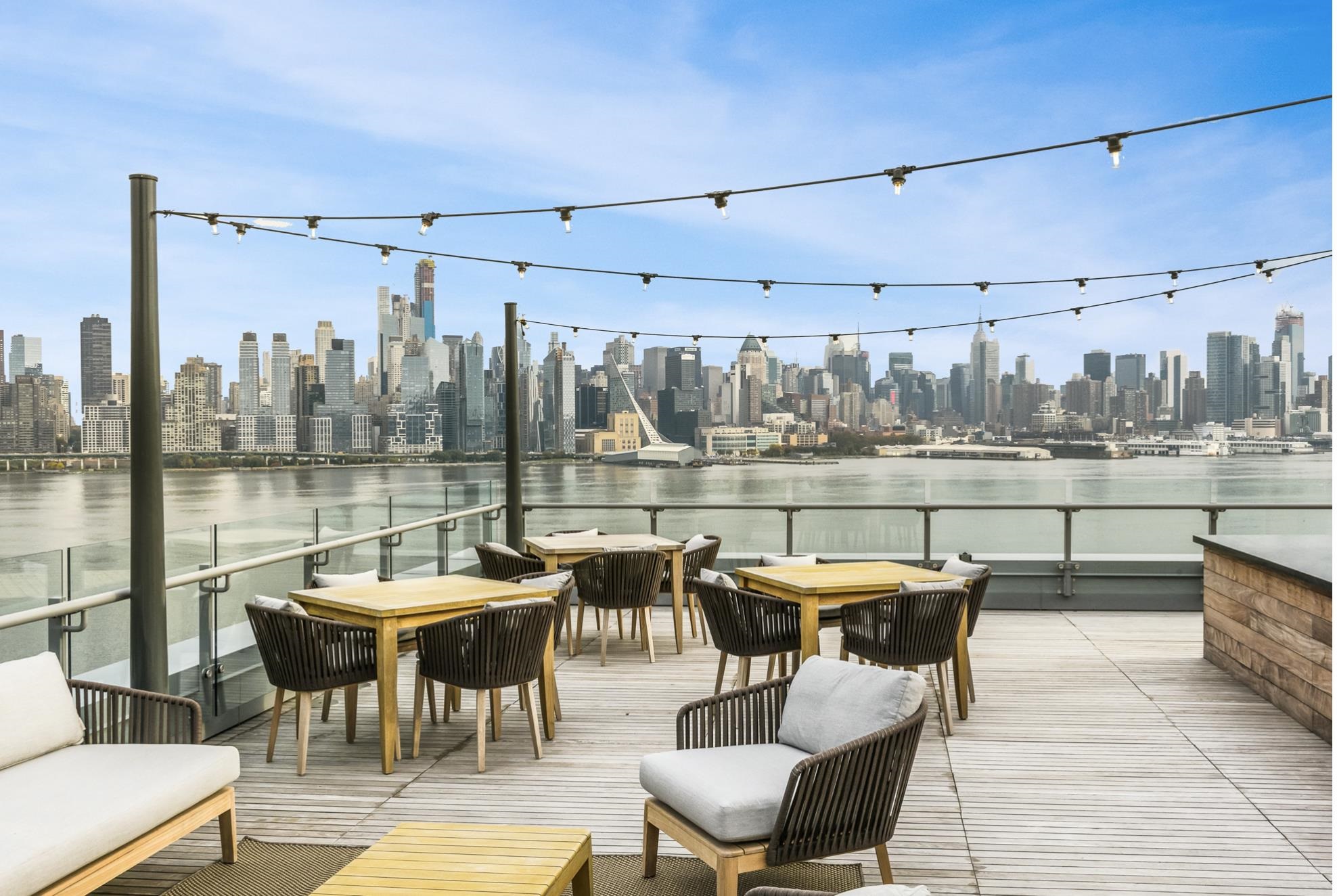 9 Ave At Port Imperial, Unit 925 West New York, NJ 07093 - Photo 13 of 14 a outdoor space with lots of chairs and a table