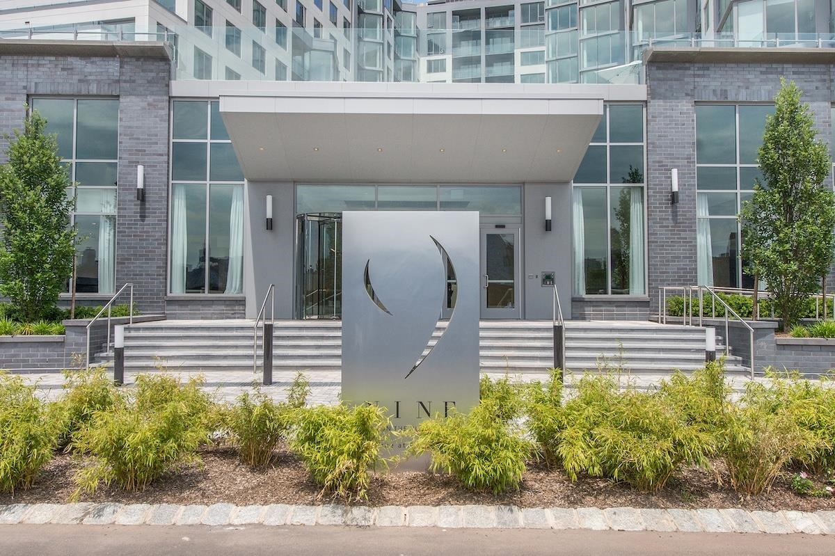 9 Ave At Port Imperial, Unit 925 West New York, NJ 07093 - Photo 2 of 14 a front view of a house with a garden