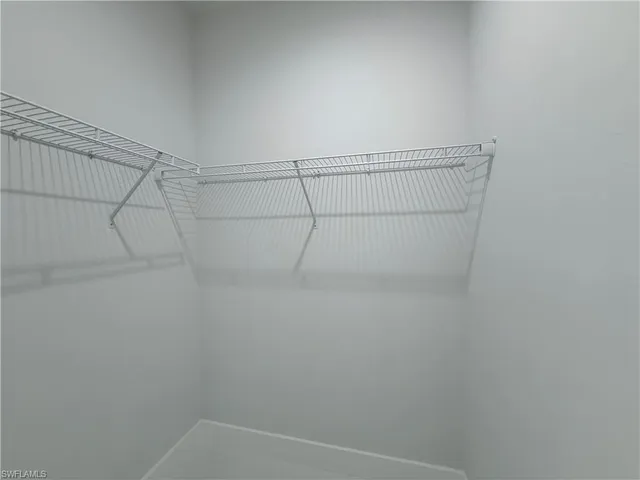 a bathroom with a double vanity sink mirror and shower