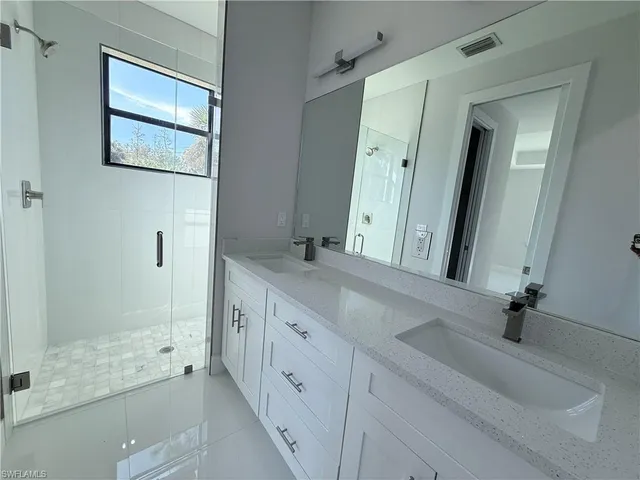 a bathroom with a sink and vanity