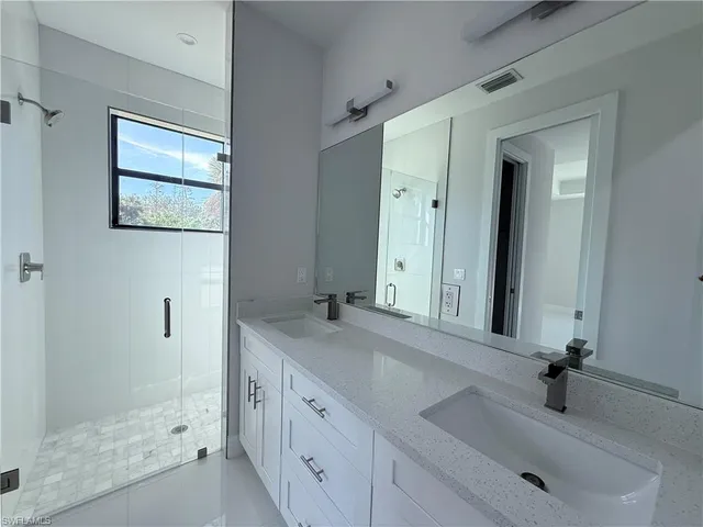 a house that has a tree in front of it