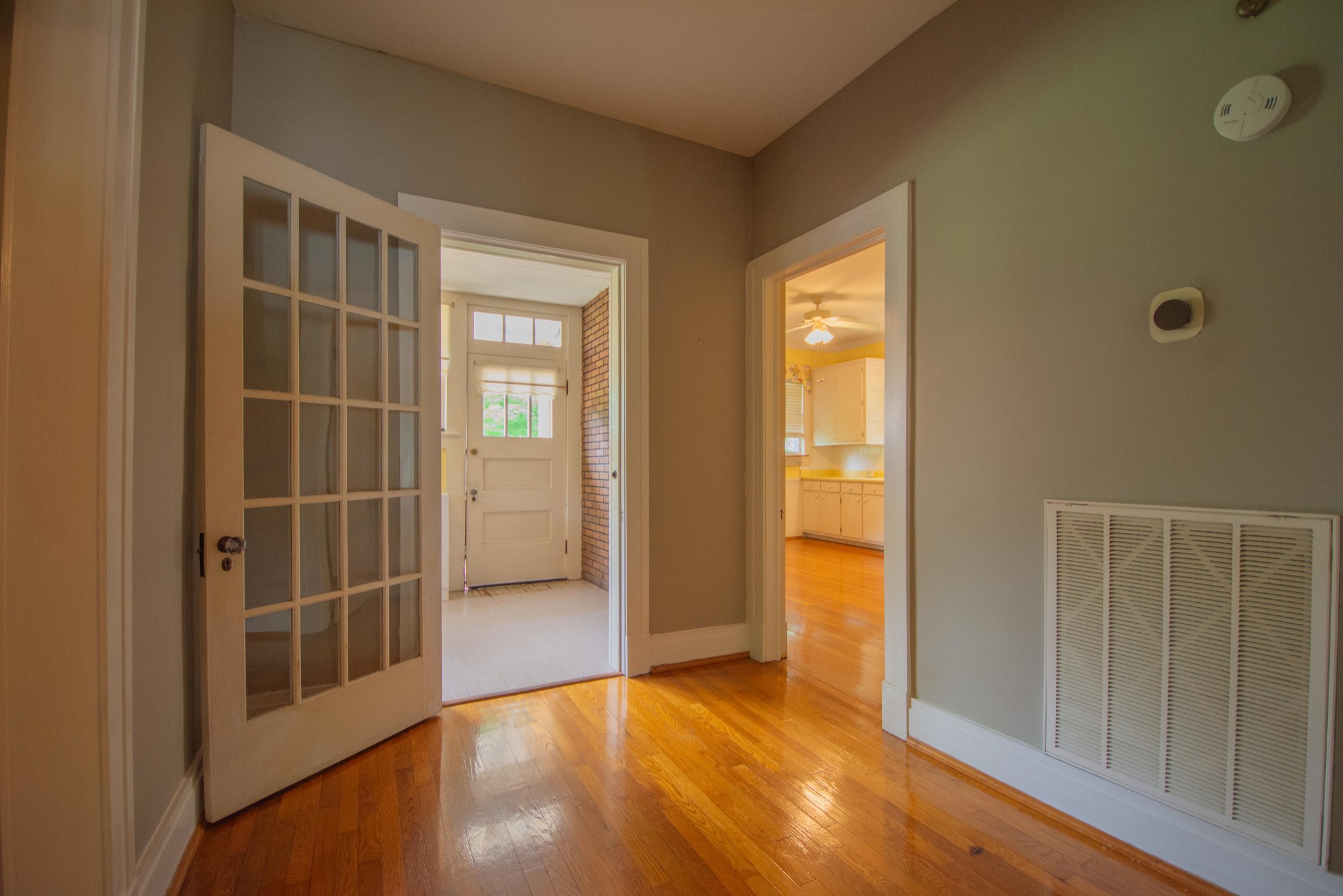 311 South 3rd Street Pulaski, TN 38478 - Photo 21 of 44 a view of empty room with wooden floor and door