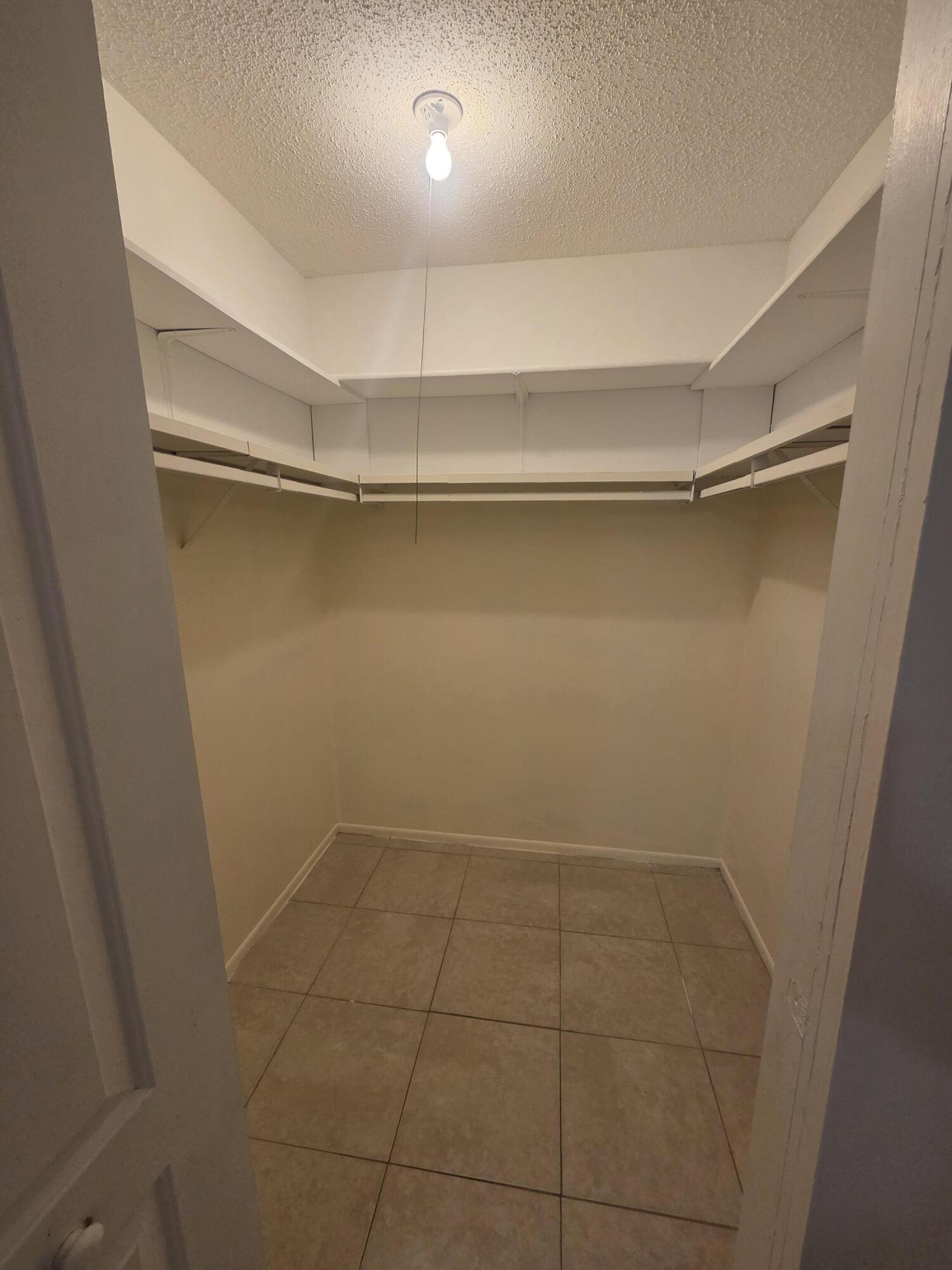 1917 Southeast Burgundy Lane Port St. Lucie, FL 34952 - Photo 11 of 13 a view of an empty walk in closet