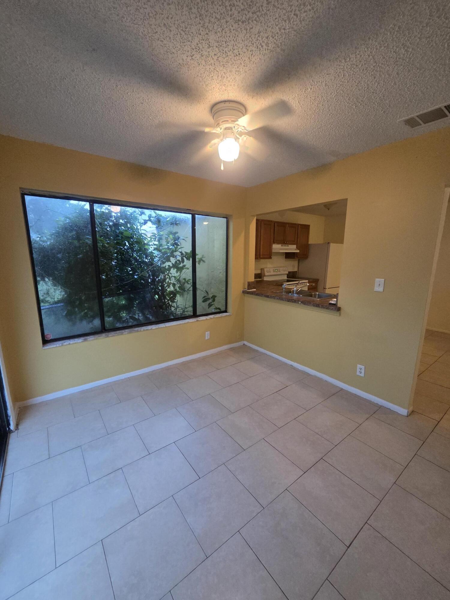 1917 Southeast Burgundy Lane Port St. Lucie, FL 34952 - Photo 2 of 13 a view of an empty room with a window