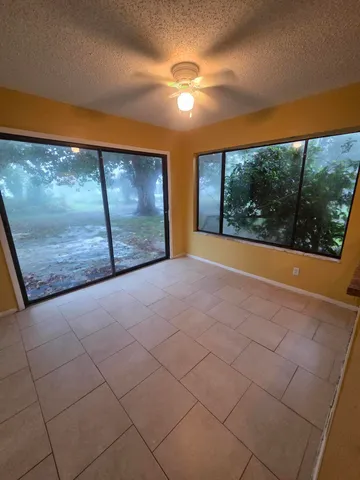 a view of a room with a large window