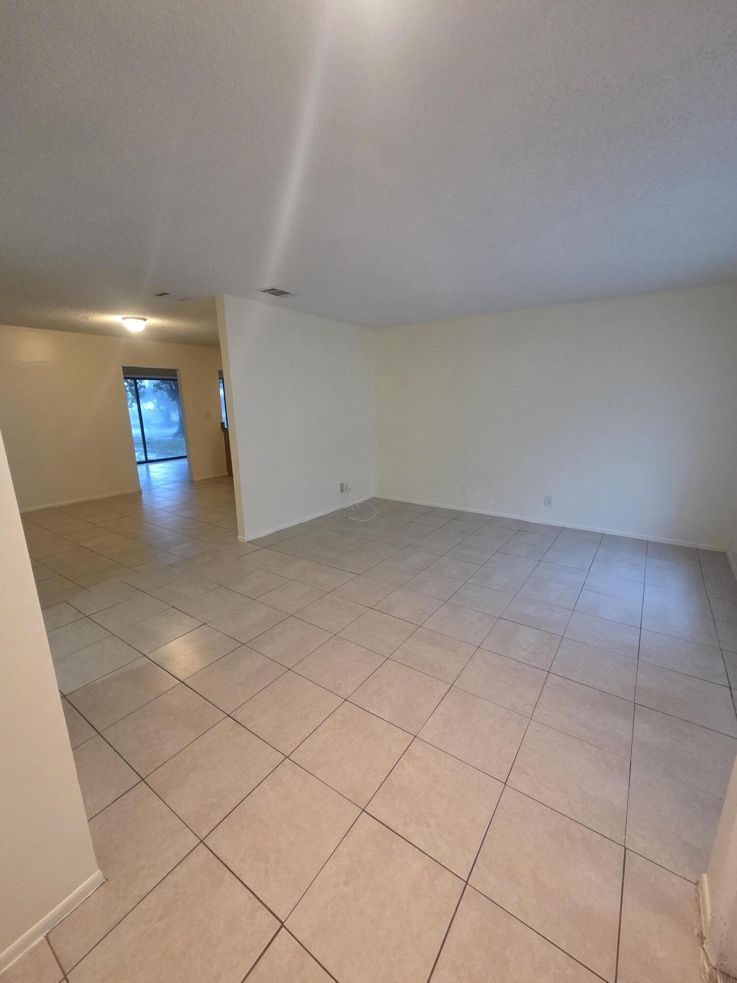 1917 Southeast Burgundy Lane Port St. Lucie, FL 34952 - Photo 9 of 13 a view of an empty room and window