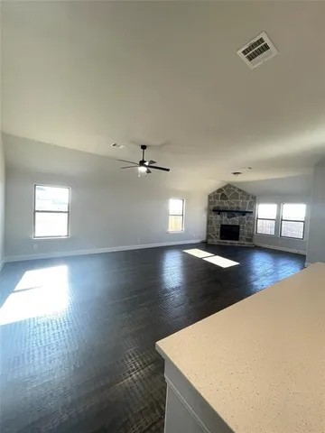 a view of livingroom and hardwood floor