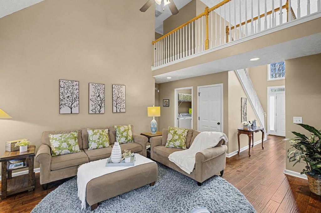 218 Amaranth Court Ball Ground, GA 30107 - Photo 12 of 46 a living room with furniture and a large window