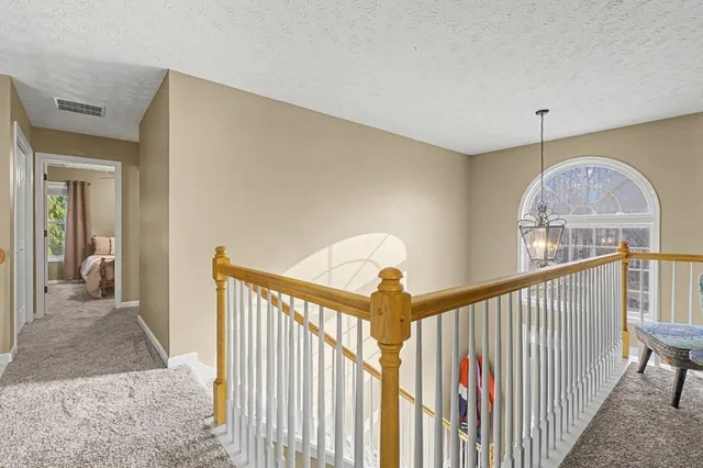 a view of a hallway view with staircase