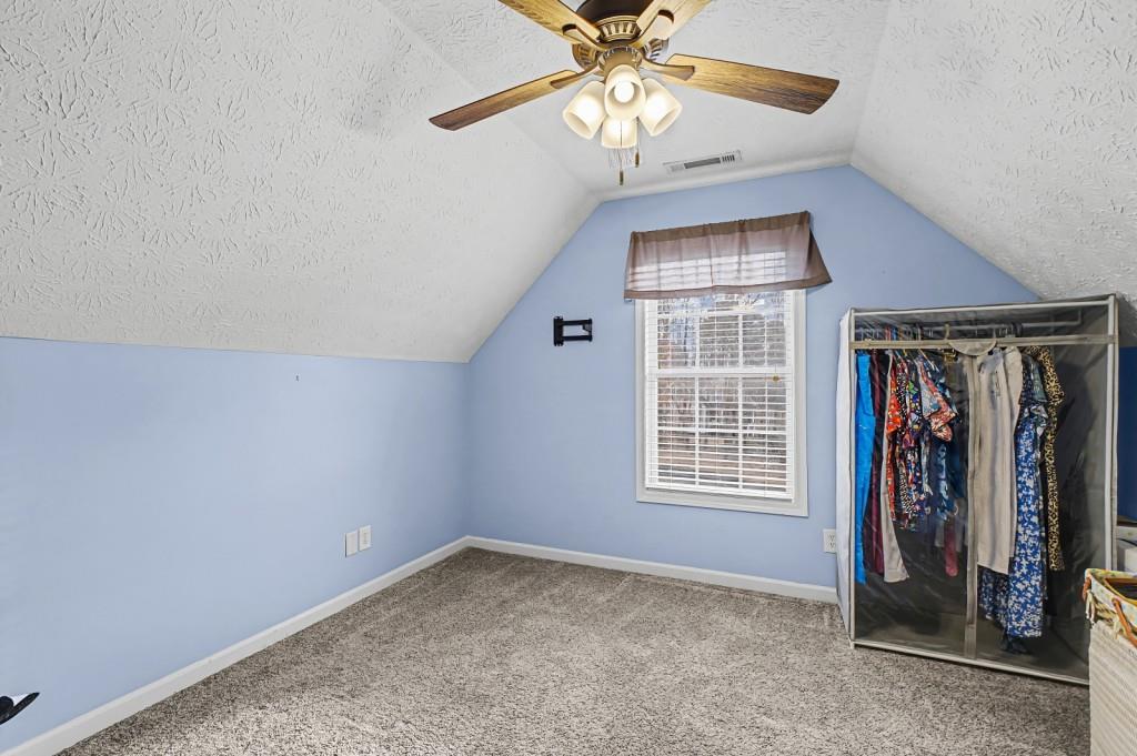 218 Amaranth Court Ball Ground, GA 30107 - Photo 29 of 46 wooden floor in an empty room with a window