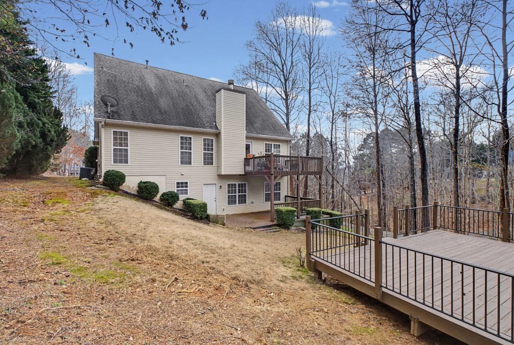 218 Amaranth Court Ball Ground, GA 30107 - Photo 37 of 46 a view of a house with a yard covered in snow