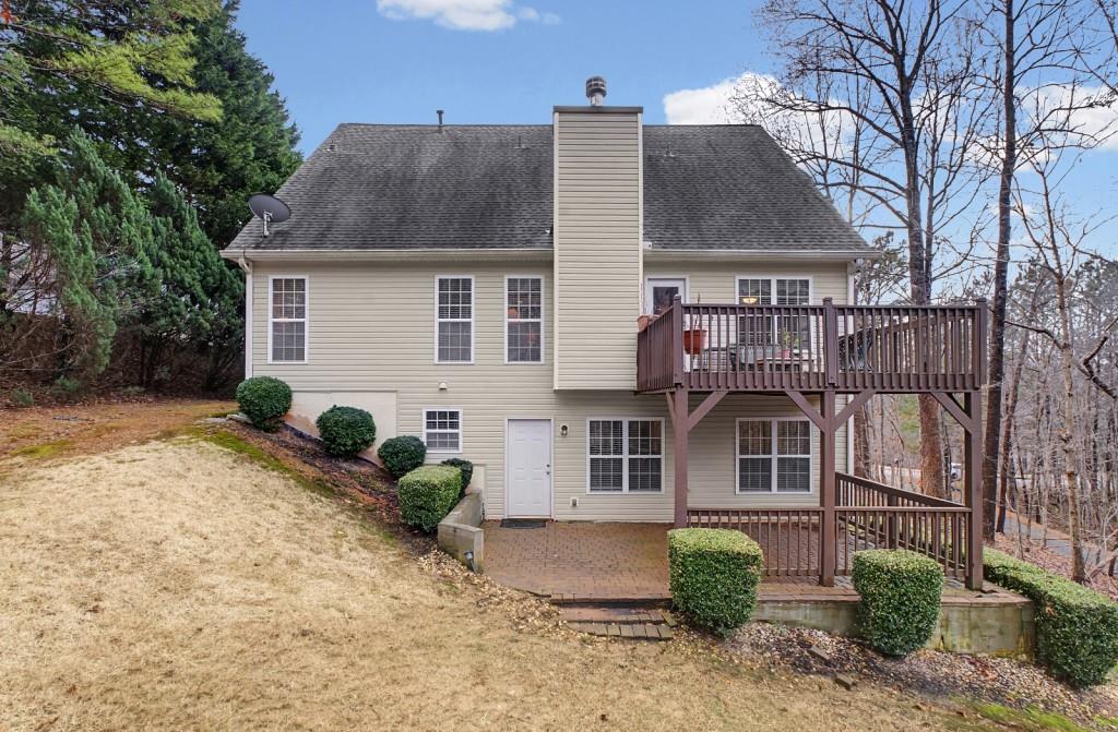 218 Amaranth Court Ball Ground, GA 30107 - Photo 38 of 46 a view of a house with a yard and potted plants