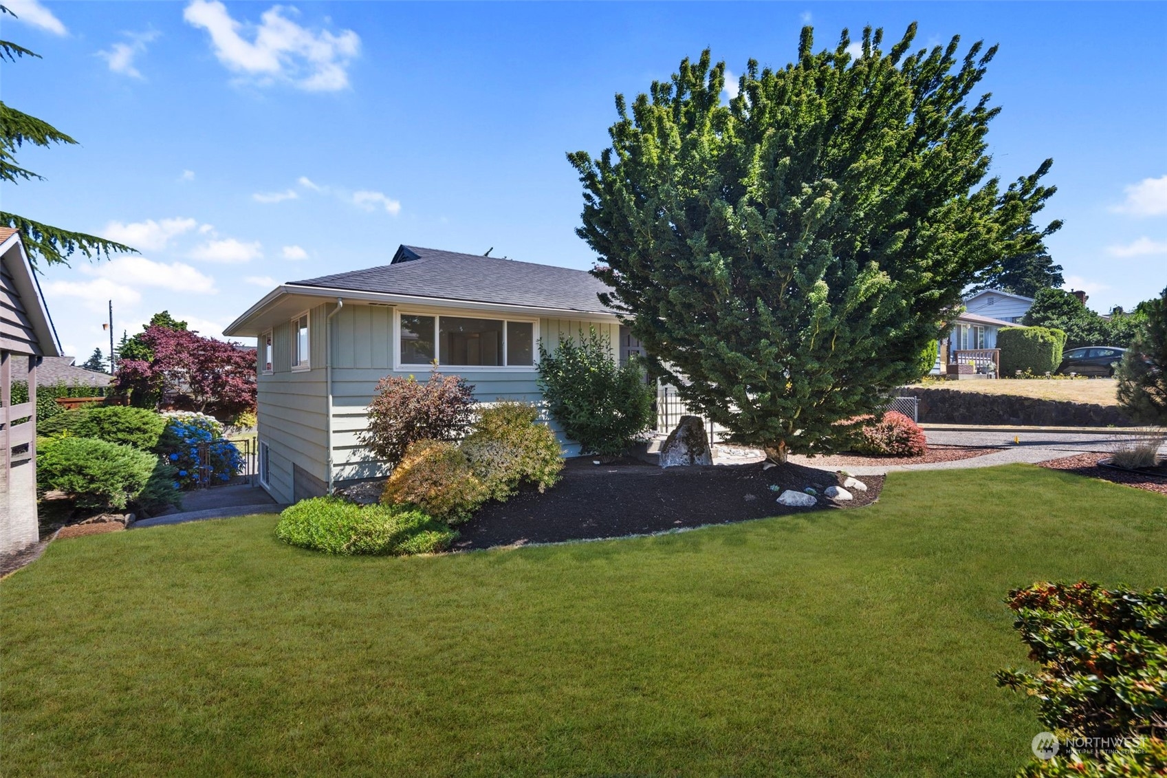 6018 South 119th Street Seattle, WA 98178 - Photo 2 of 33 a front view of a house with garden