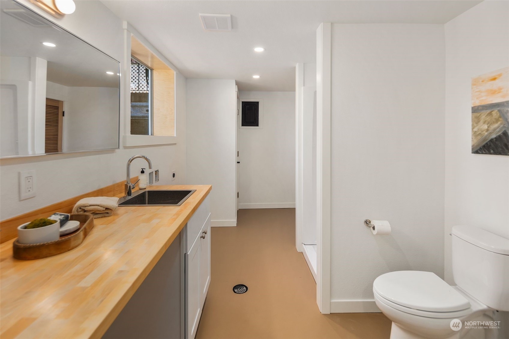 6018 South 119th Street Seattle, WA 98178 - Photo 23 of 33 a bathroom with a sink a toilet and shower