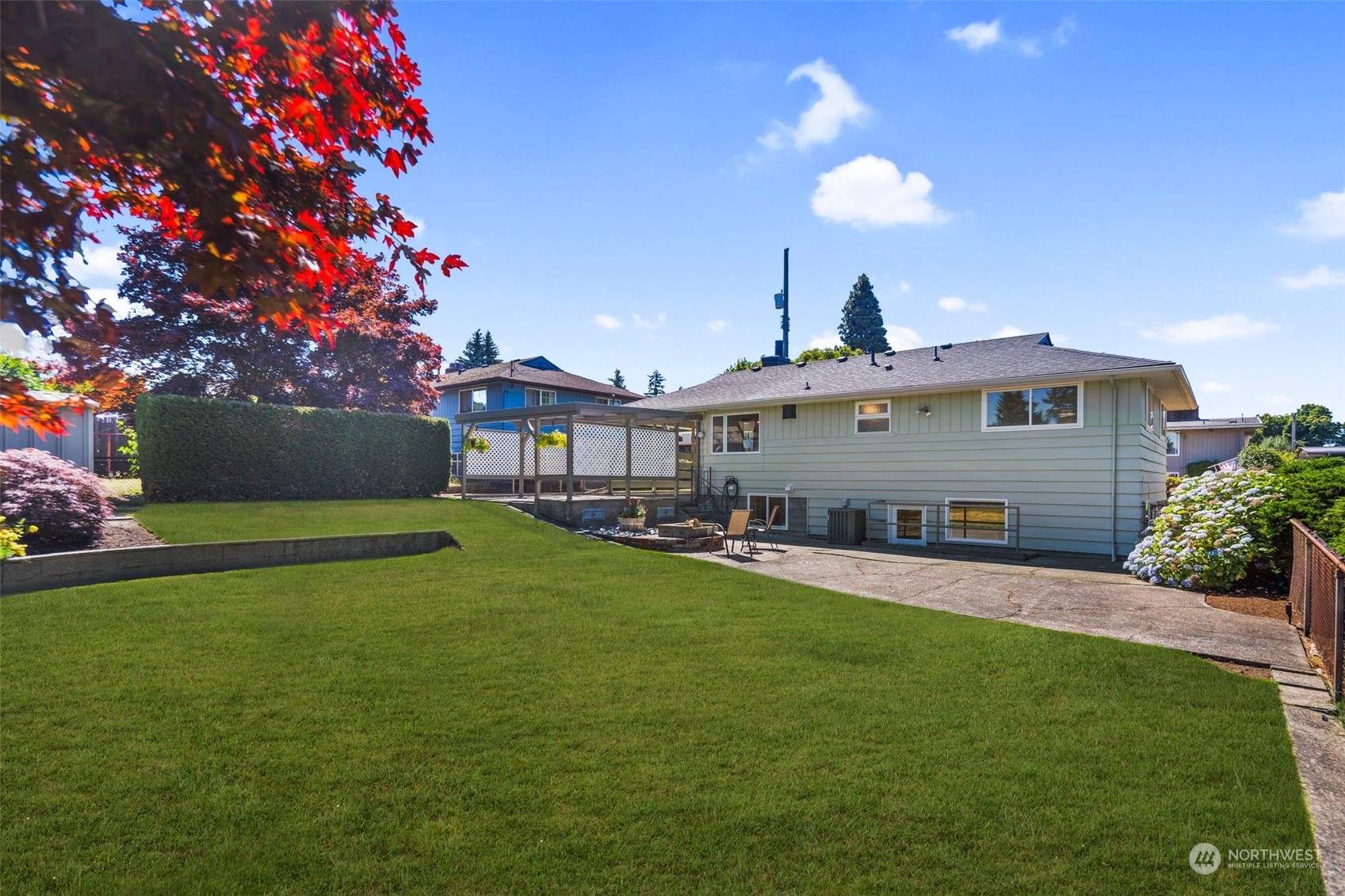 6018 South 119th Street Seattle, WA 98178 - Photo 25 of 33 a front view of house with yard and outdoor seating