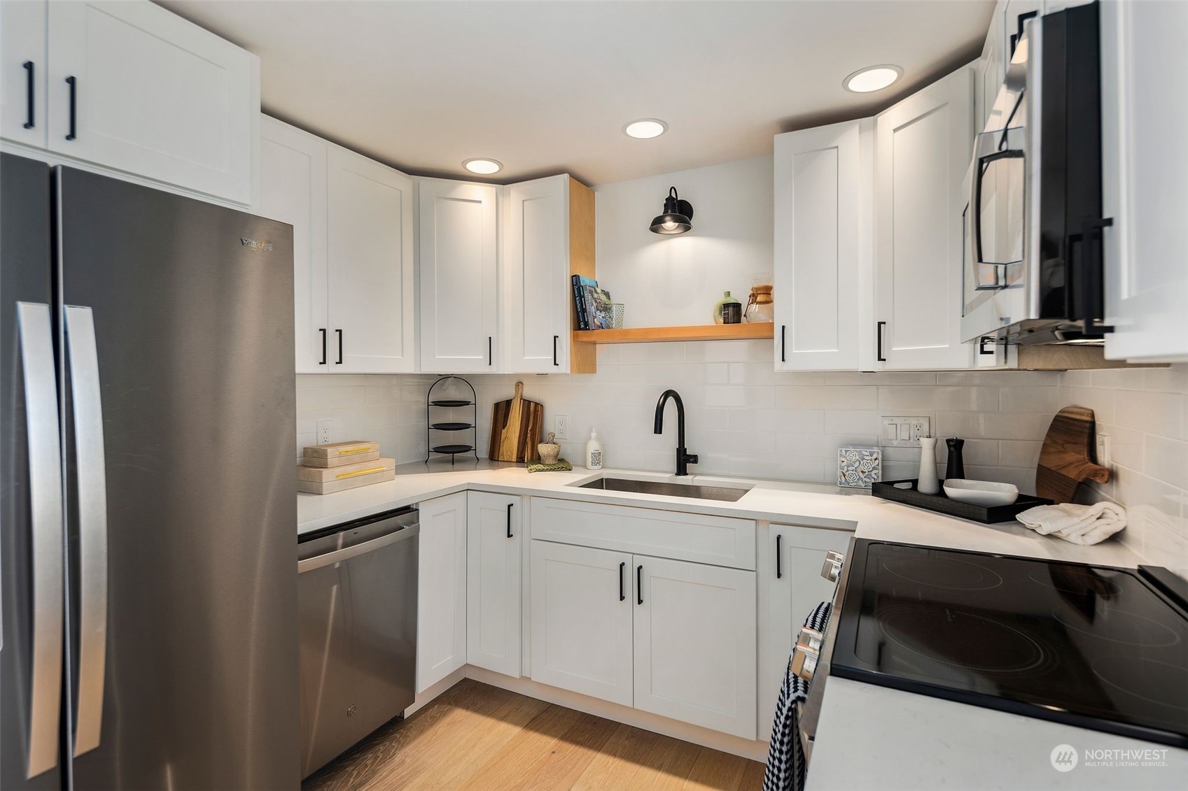 6018 South 119th Street Seattle, WA 98178 - Photo 5 of 33 a kitchen with a sink stove and refrigerator