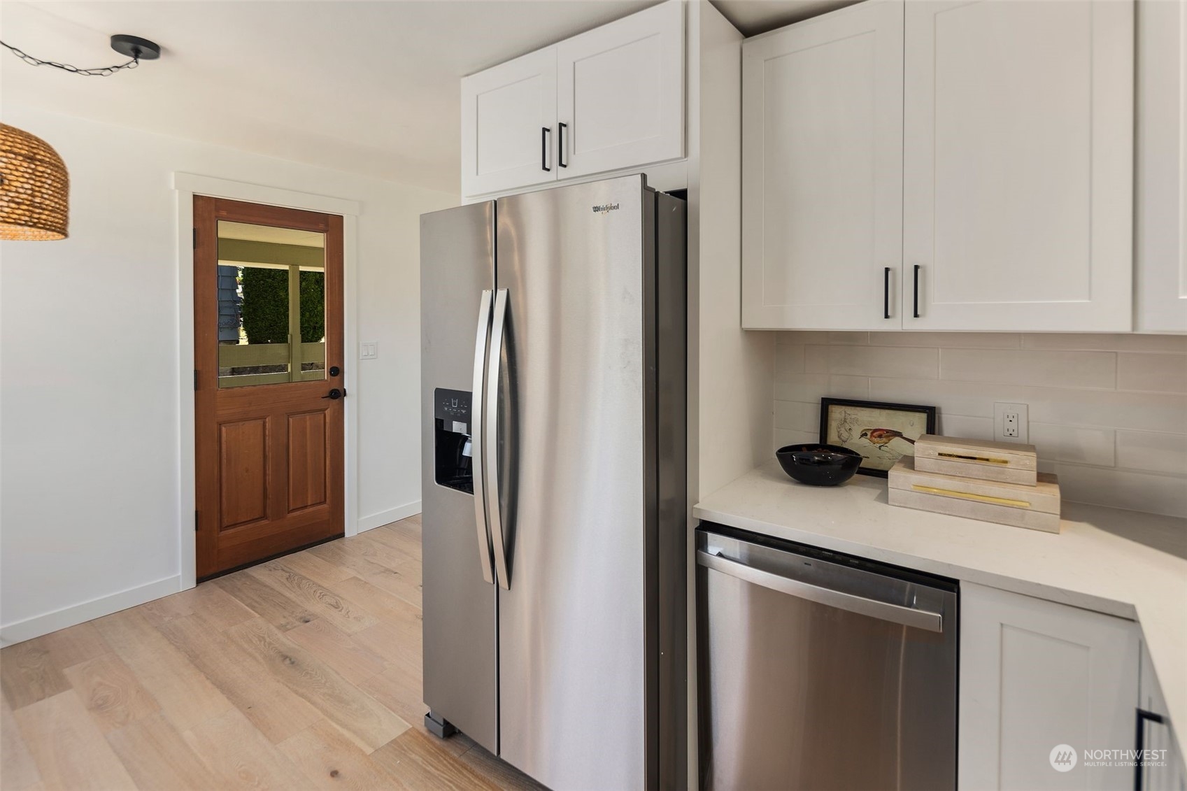 6018 South 119th Street Seattle, WA 98178 - Photo 8 of 33 a kitchen with stainless steel appliances granite countertop a refrigerator and a sink