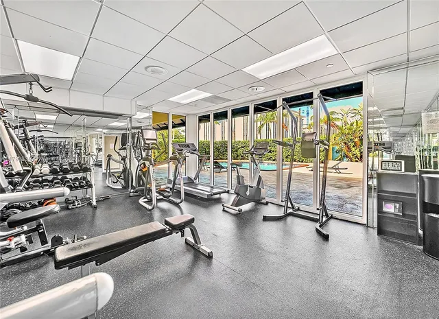 a view of a backyard with plants and patio