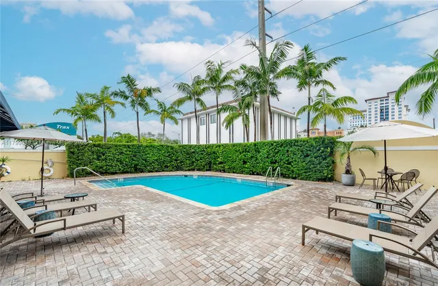 a view of a swimming pool with a patio