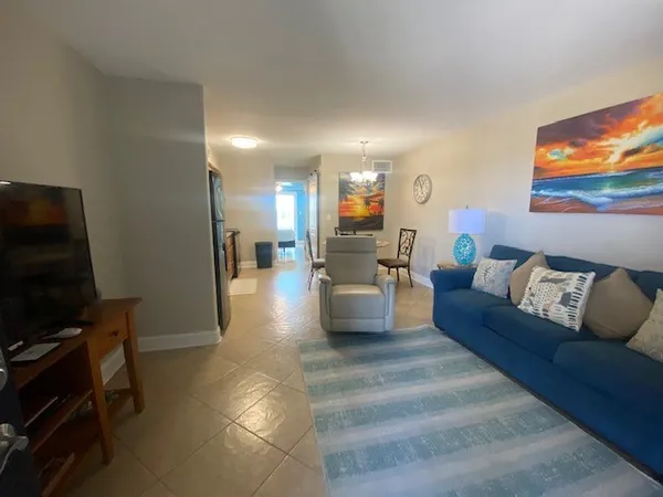 a kitchen with a table chairs stove and microwave