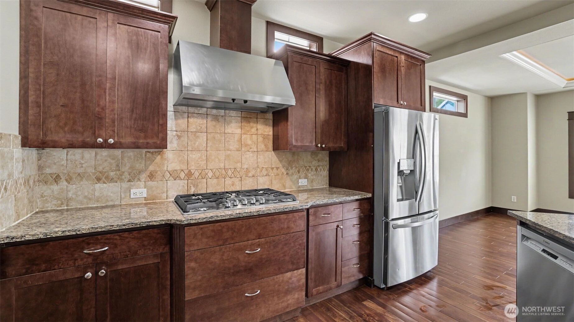 1357 Elma Place Northeast Renton, WA 98059 - Photo 12 of 40 a kitchen with stainless steel appliances granite countertop a refrigerator stove and sink