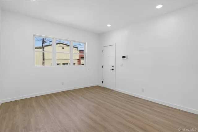 a view of room with wooden floor