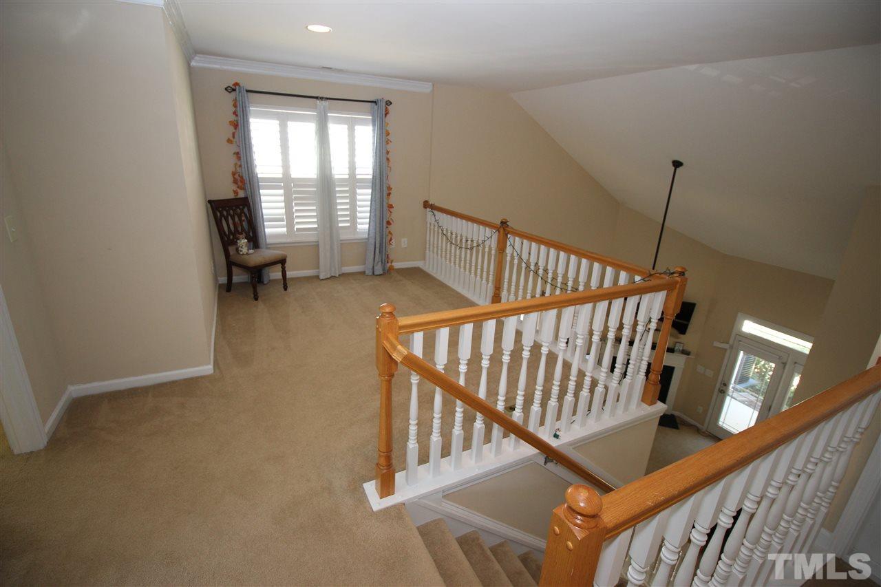 4720 Altha Street Raleigh, NC 27606 - Photo 8 of 11 a view of entryway and hall with wooden floor