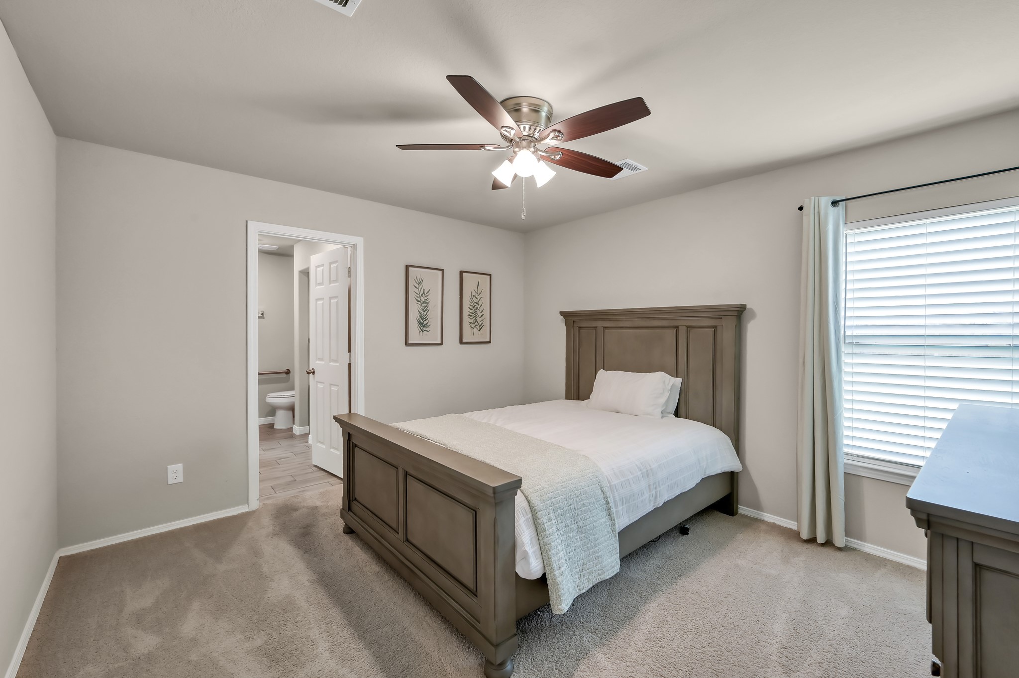 514 Dalloway Street Conroe, TX 77316 - Photo 12 of 27 Spacious primary bedroom with natural light and neutral tones