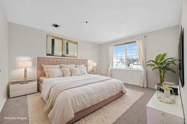 a bedroom with a bed and window