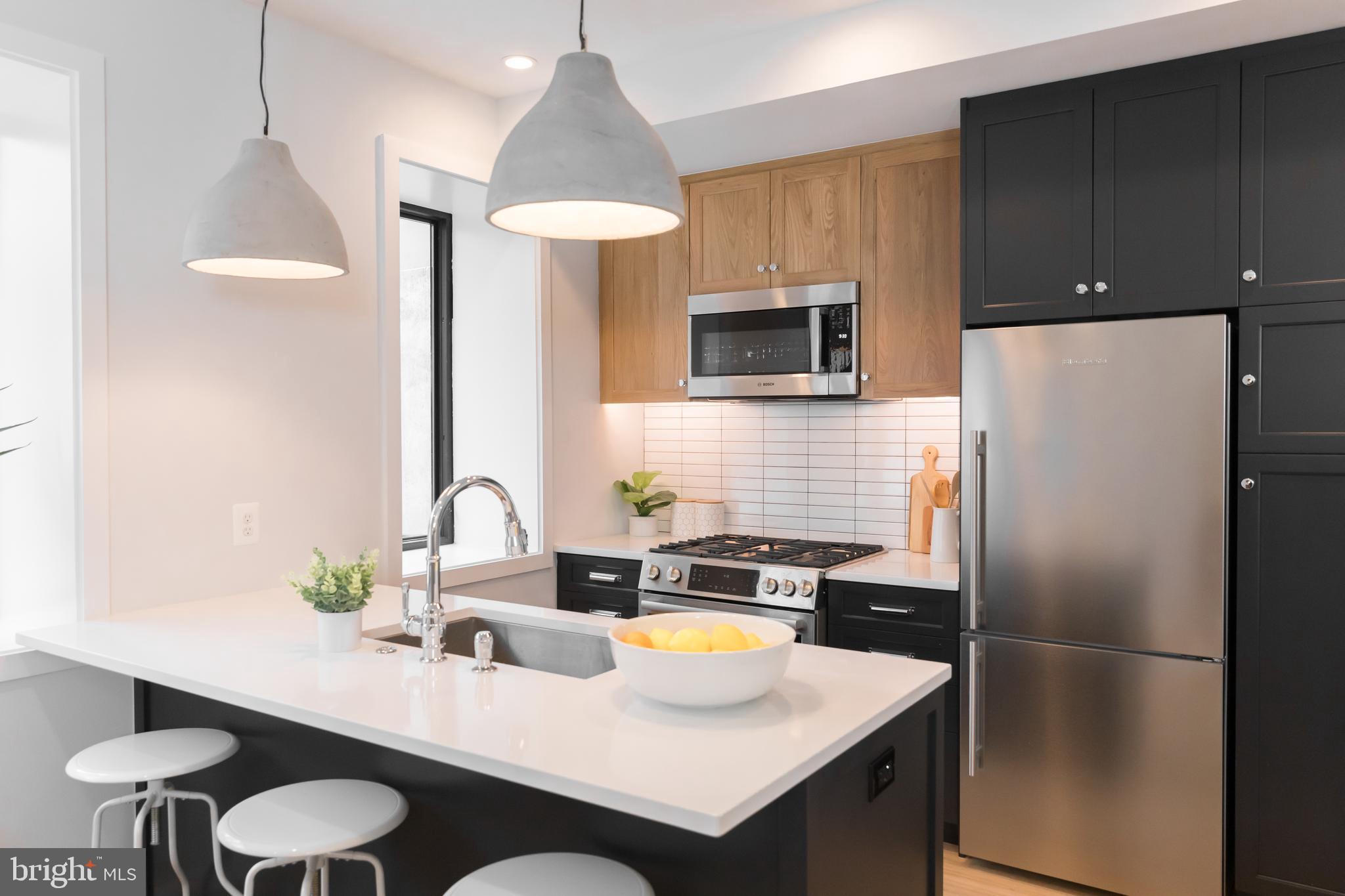 2248 Ontario Road Northwest, Unit 1 Washington, DC 20009 - Photo 4 of 23 Custom concrete pendants,hidden under cab lighting