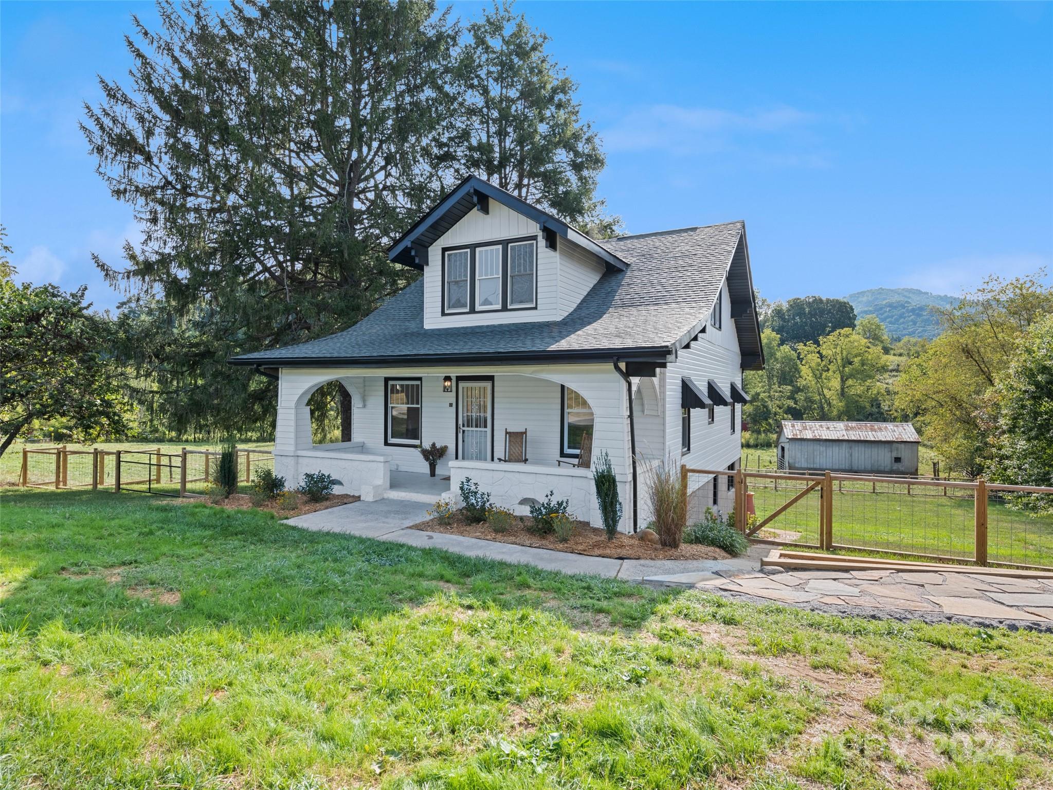 15 Scottdale Road Canton, NC 28716 - Photo 1 of 30 a front view of house with yard and outdoor seating