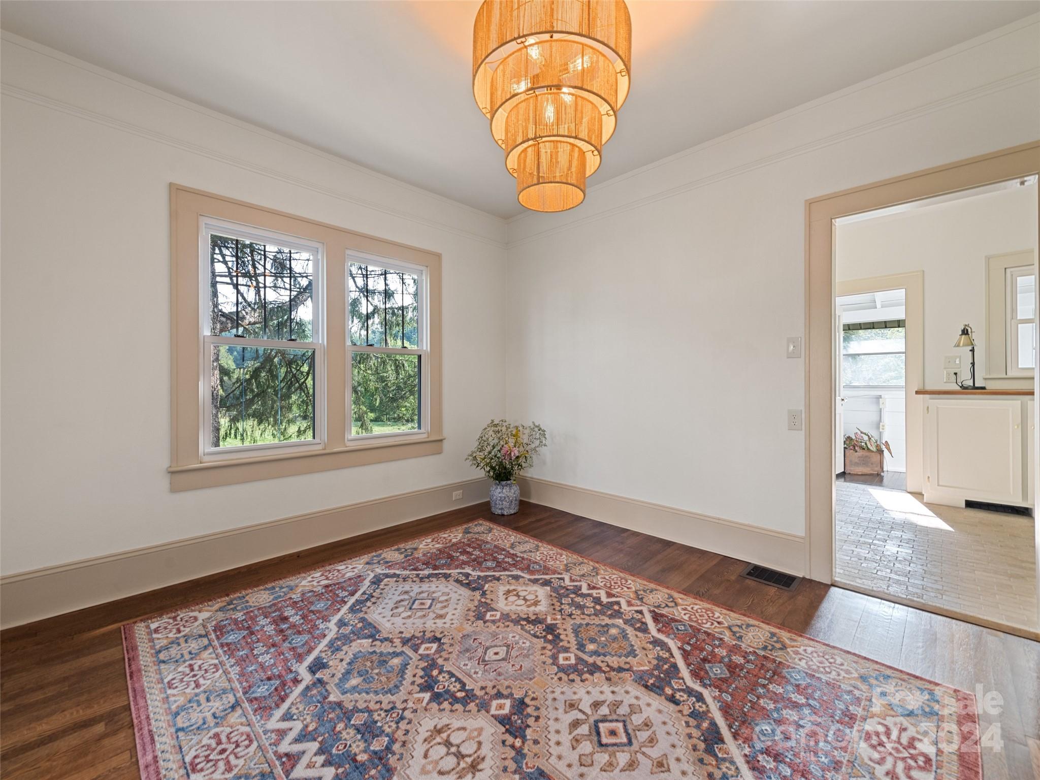 15 Scottdale Road Canton, NC 28716 - Photo 11 of 30 wooden floor in an empty room with a window