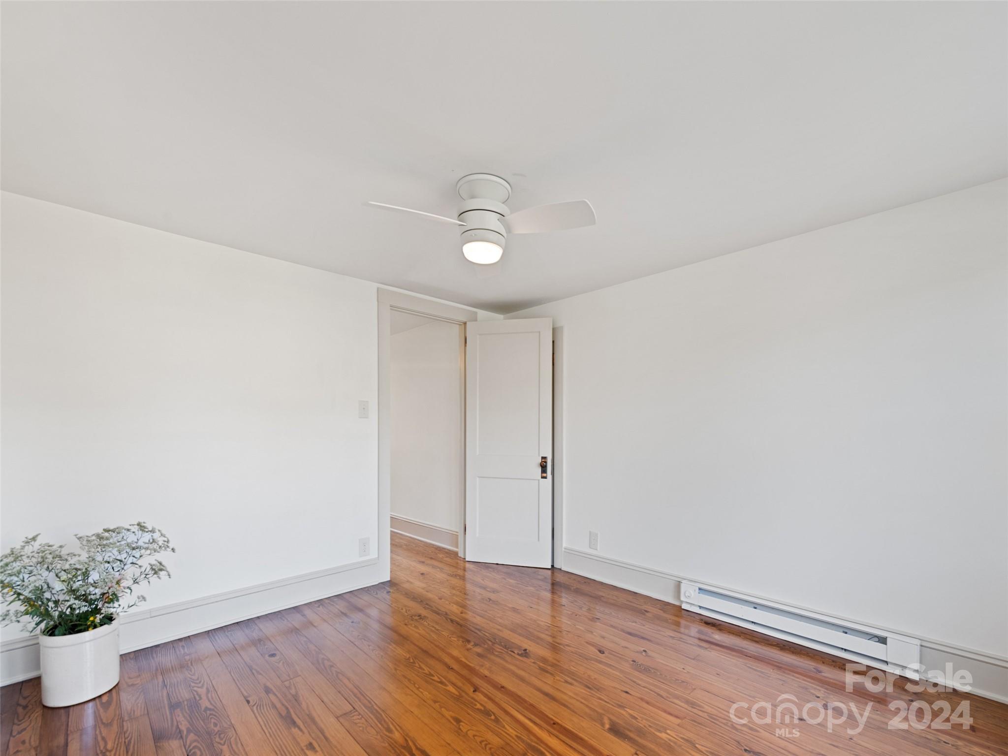 15 Scottdale Road Canton, NC 28716 - Photo 25 of 30 a view of an empty room with wooden floor