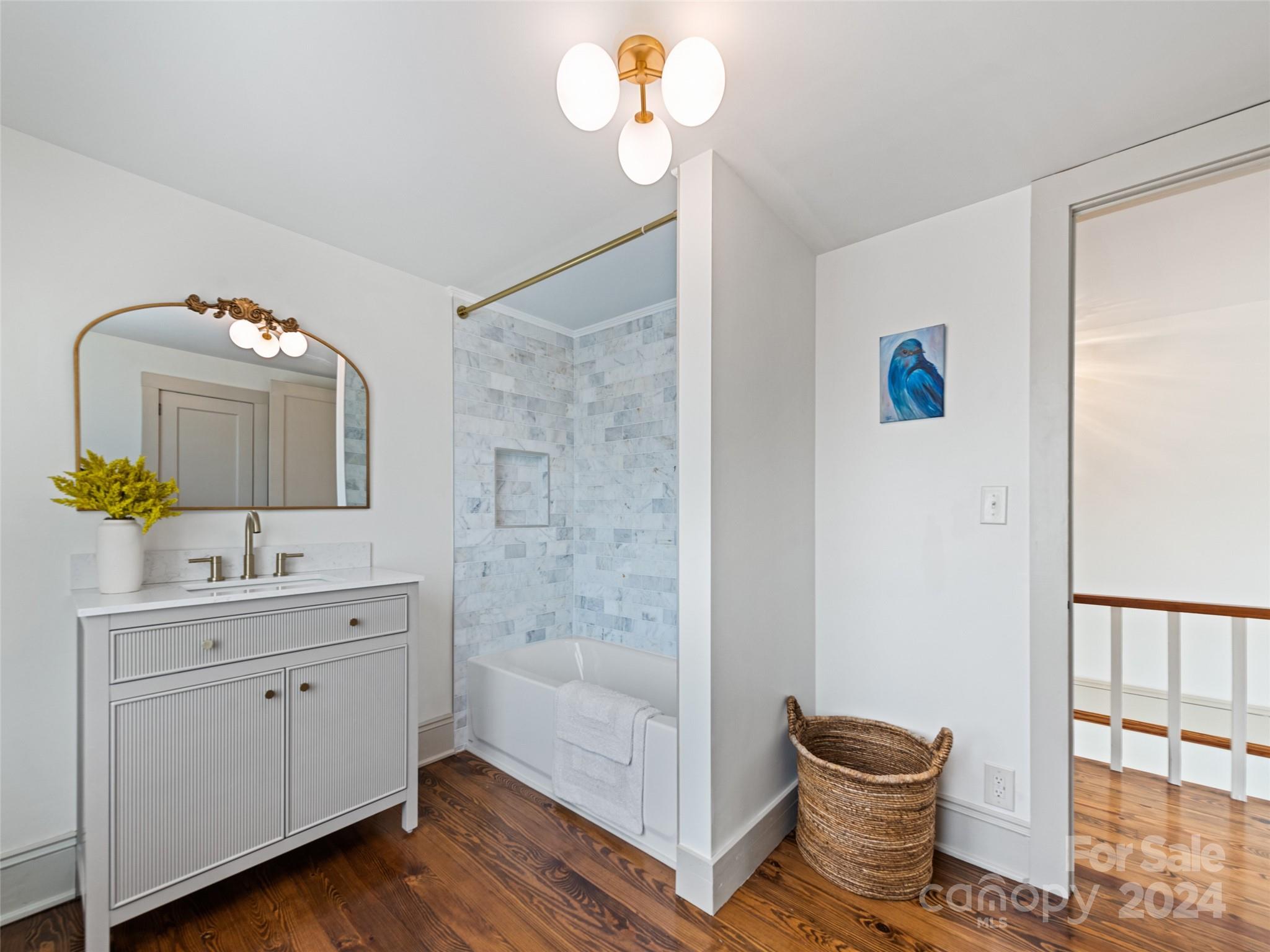 15 Scottdale Road Canton, NC 28716 - Photo 28 of 30 a bathroom with a toilet a sink and mirror