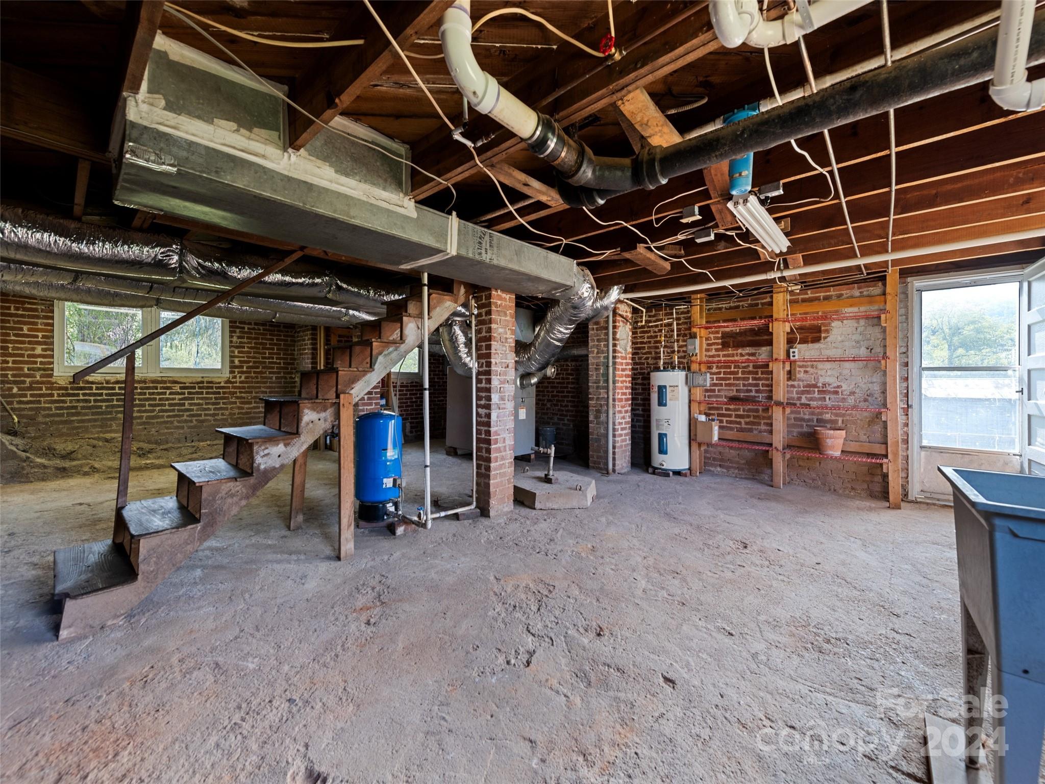 15 Scottdale Road Canton, NC 28716 - Photo 30 of 30 a view of water heater room with refrigerator