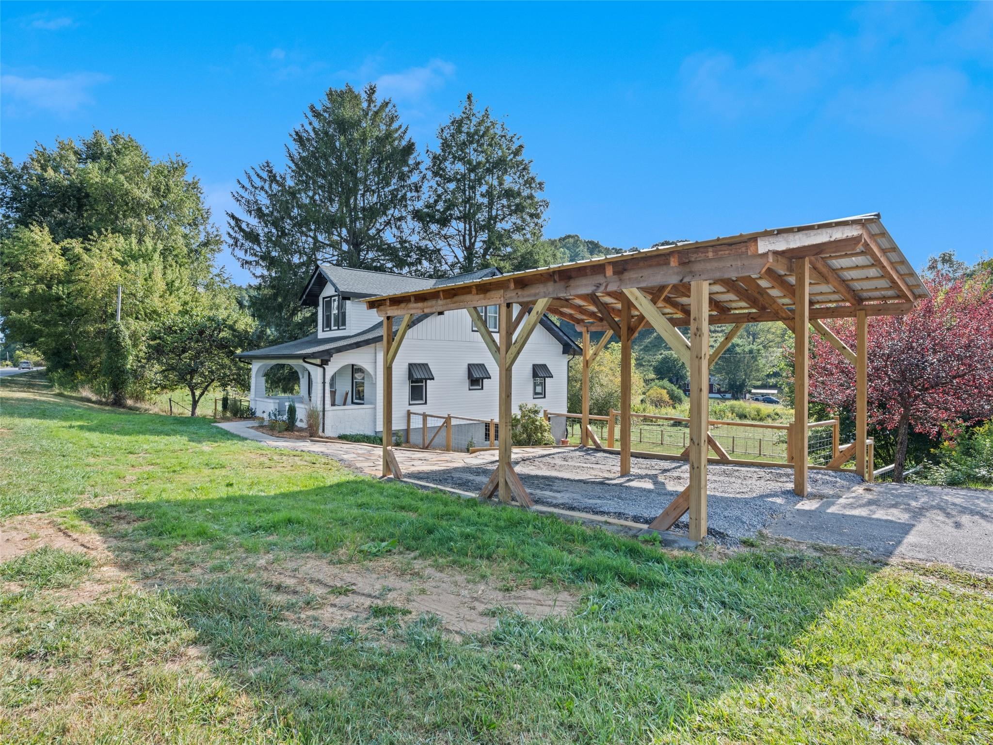 15 Scottdale Road Canton, NC 28716 - Photo 3 of 30 a view of a house with backyard and a tree