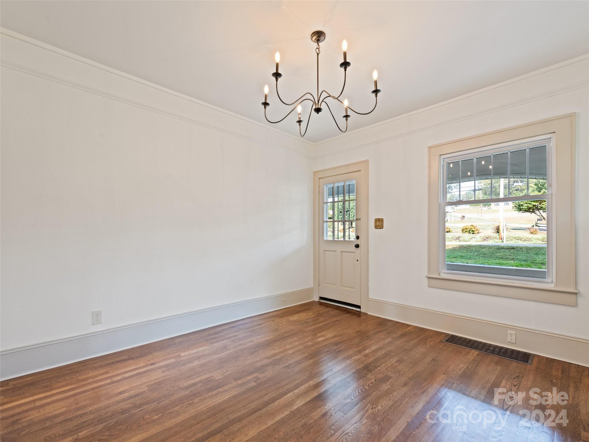15 Scottdale Road Canton, NC 28716 - Photo 9 of 30 wooden floor in an empty room with a window