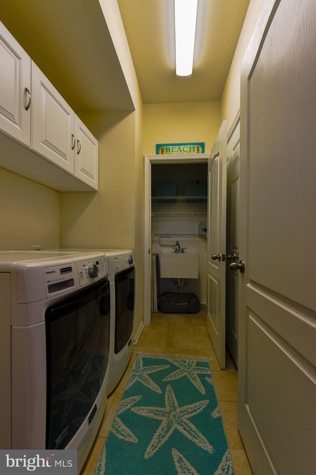 34148 Spring Brook Avenue Lewes, DE 19958 - Photo 39 of 77 a kitchen with a stove and a refrigerator